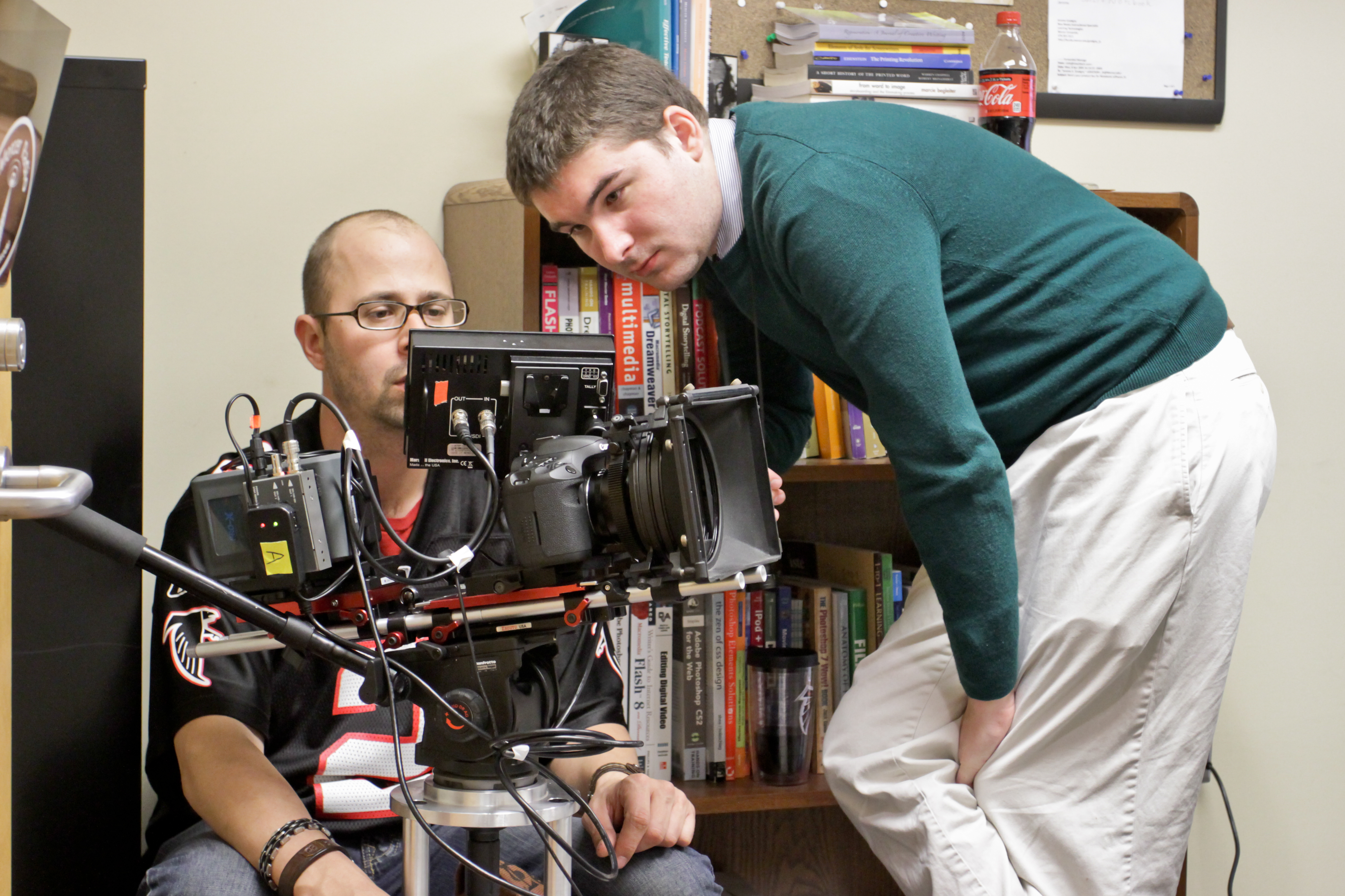 Director James Kicklighter reviews the shot with FOLLOWED Director of Photography Jason Winn.
