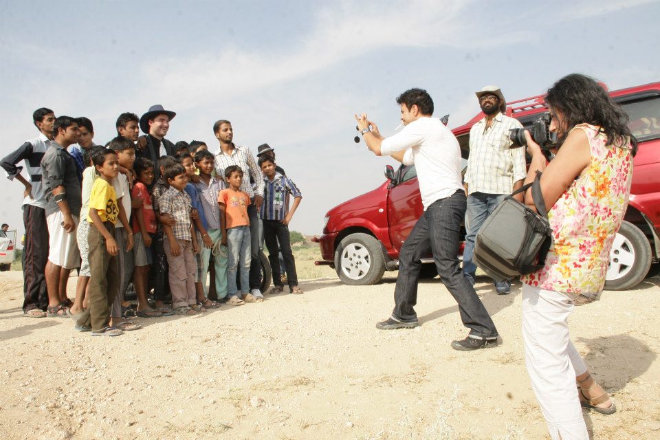 DESIRES OF THE HEART director James Kicklighter meets villagers outside Bikaner on the set with actor Val Lauren.