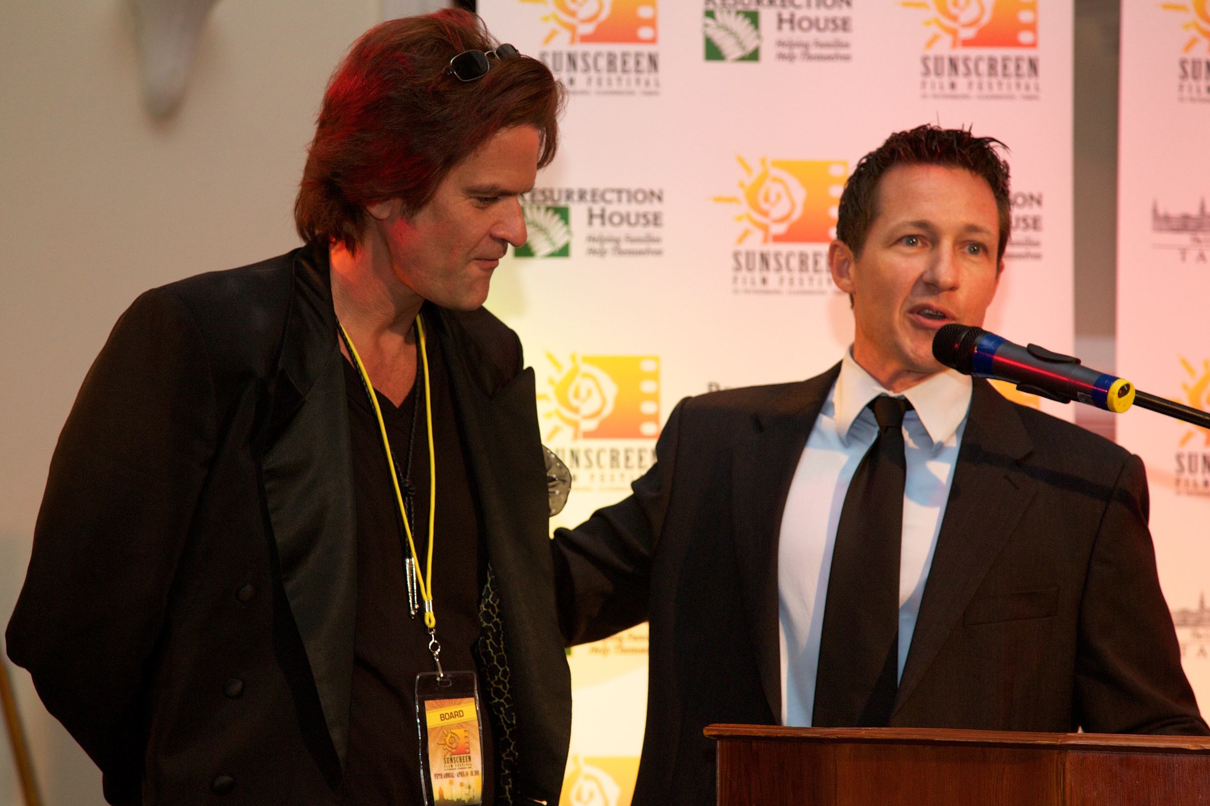 Tony Armer presents filmmaker Tom Garrett with a film grant at the 2010 Sunscreen Film Festival Award's Ceremony.