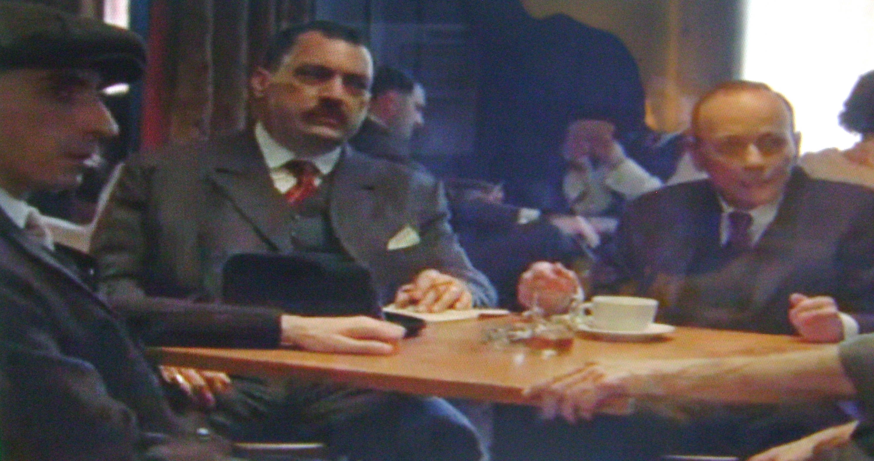 HBO Boardwalk Empire Gangster Ken Sladyk in a Chicago meeting with Johnny Torrio. Waiting with pencil and paper in hand, Johnny Torrio shows his high powered money controller the envelope thick with cash that Jake Guzik bring's in. (scene 1/10)