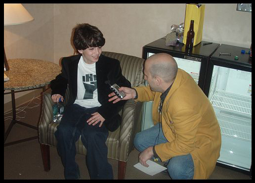 John Rebello being interviewed by Shuli, Howard 100 News, backstage at the Borgata, Atlantic City, New Jersey, Artie Lange show, 2007.