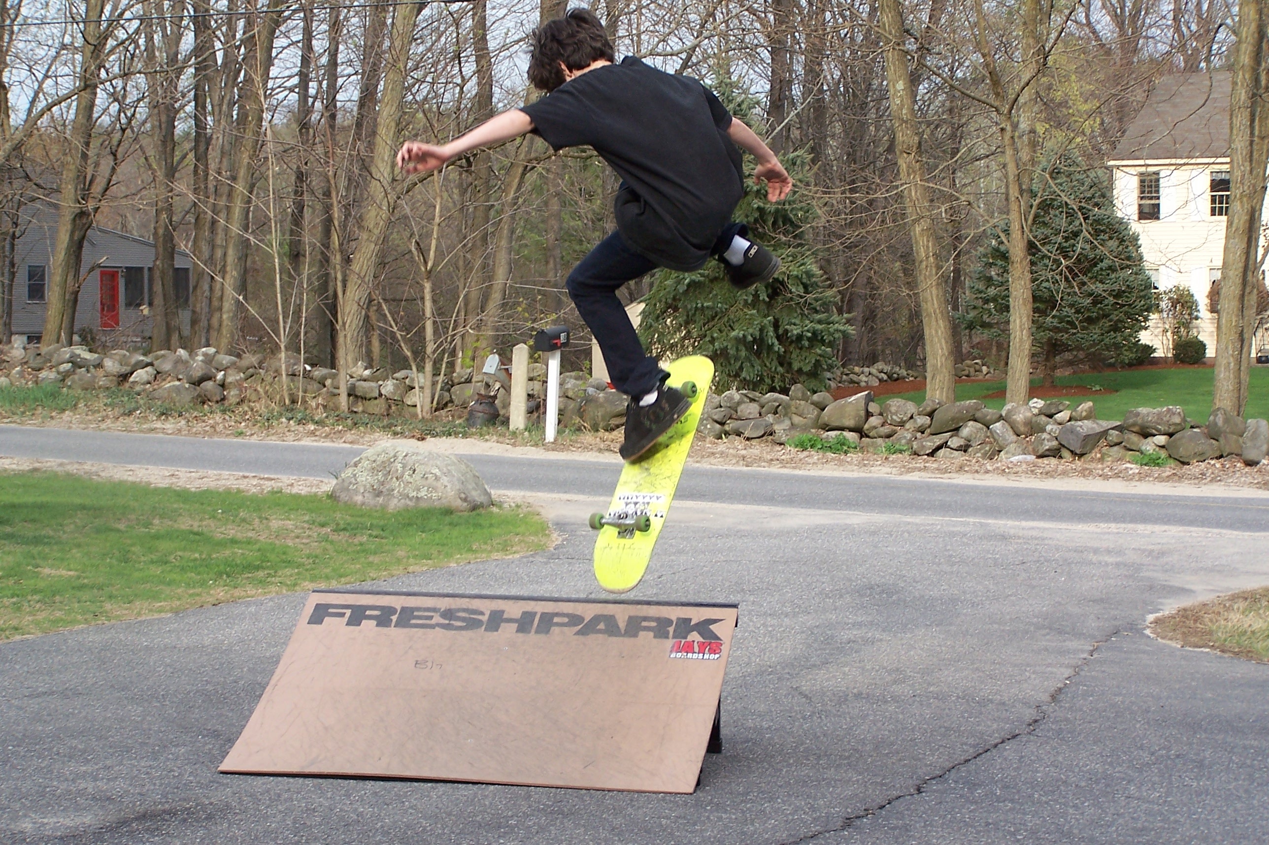 John Rebello, sk8board jump, black tee shirt