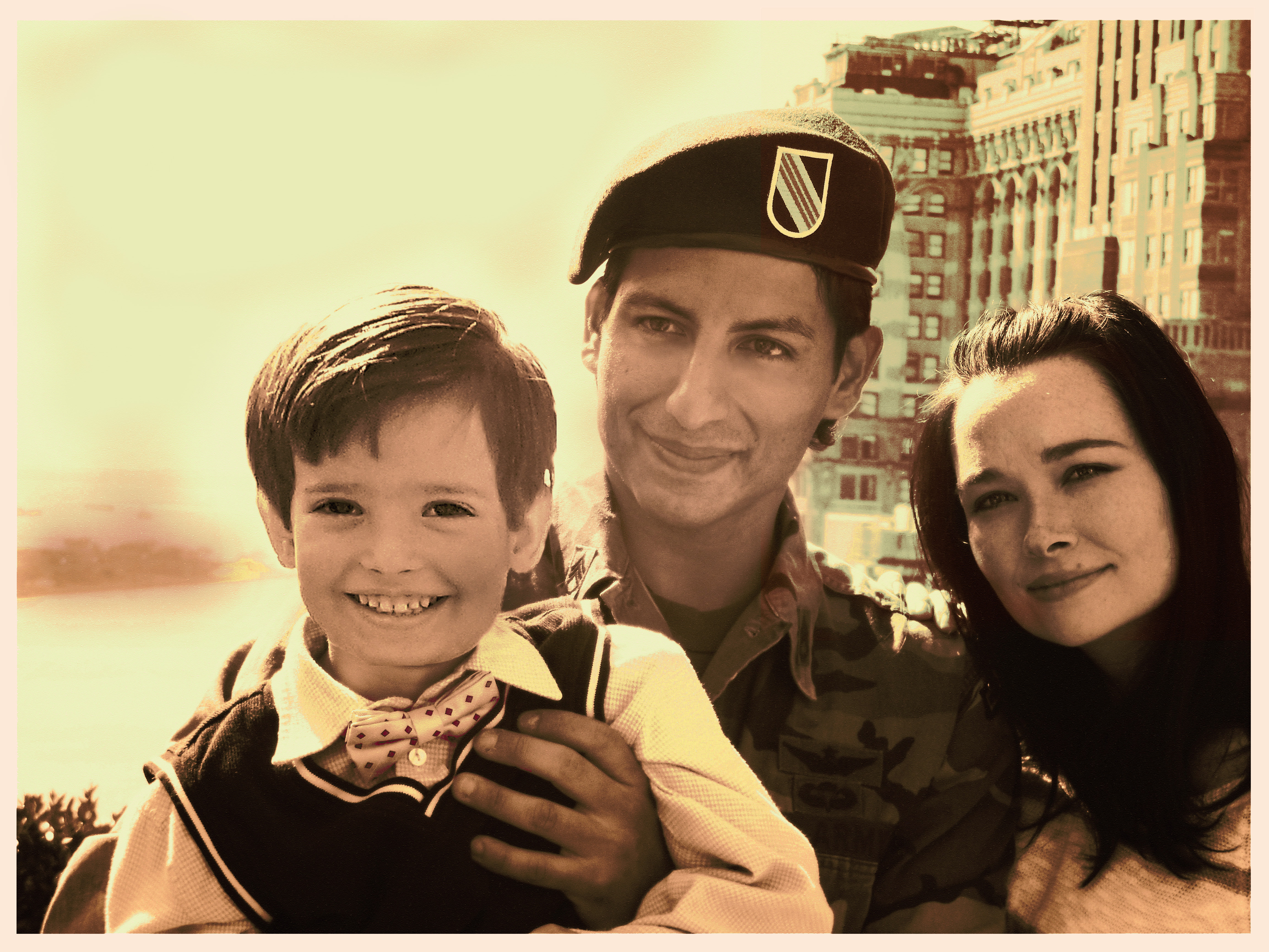 Delta Force Operator Sam Rai (Alex Kruz) with his family before flying out again. The happy stolen moment captured hiding the tension caused by the absenteeism of the soldier in his family's life.