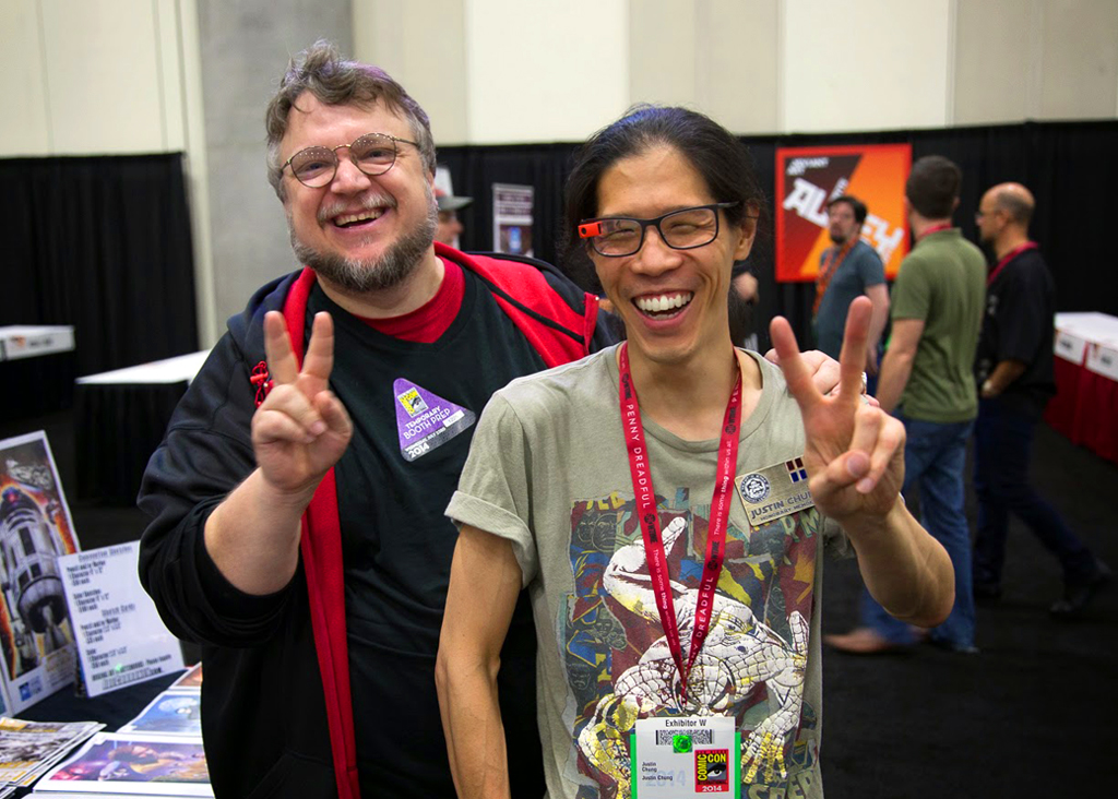 Guillermo del Toro and Justin Chung pose for a photo during exhibitor set-up at San Diego Comic-Con International 2014.