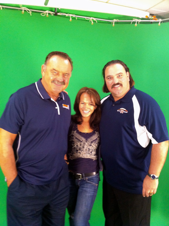 Inda Reid with Super-star Quarterback Dick Butkiss and his son. On set of the PSA Commercial for the Butkiss' 