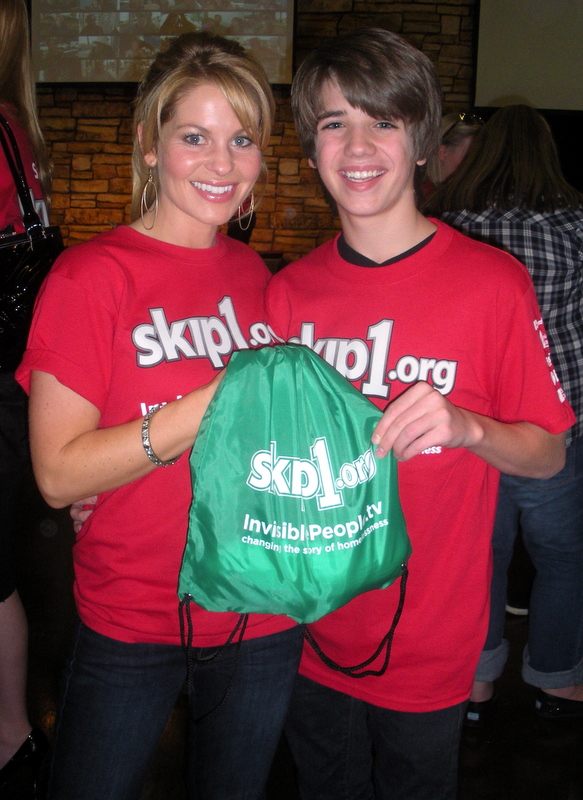 Brandon & Candace Cameron-Bure at SKIP DAY 2010. This event was for Skip1.org & they packed bags for the homeless to distribute.