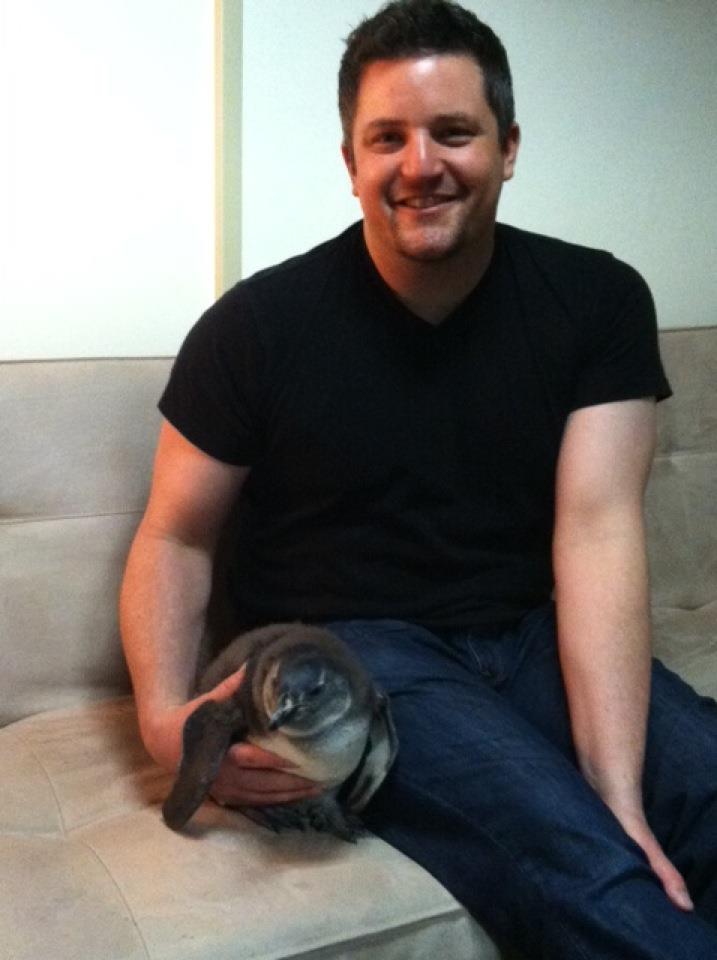 David Mizejewski backstage at the Wendy Williams Show with a juvenile penguin.