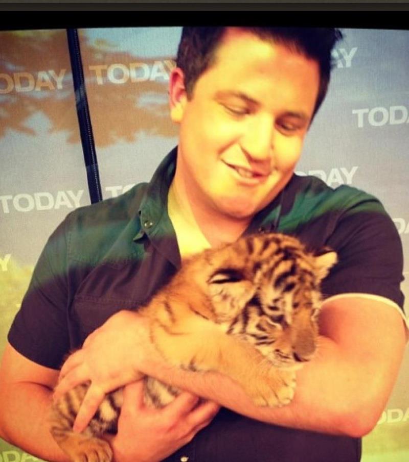 David Mizejewski with a tiger cub on one of his monthly Today Show appearances.