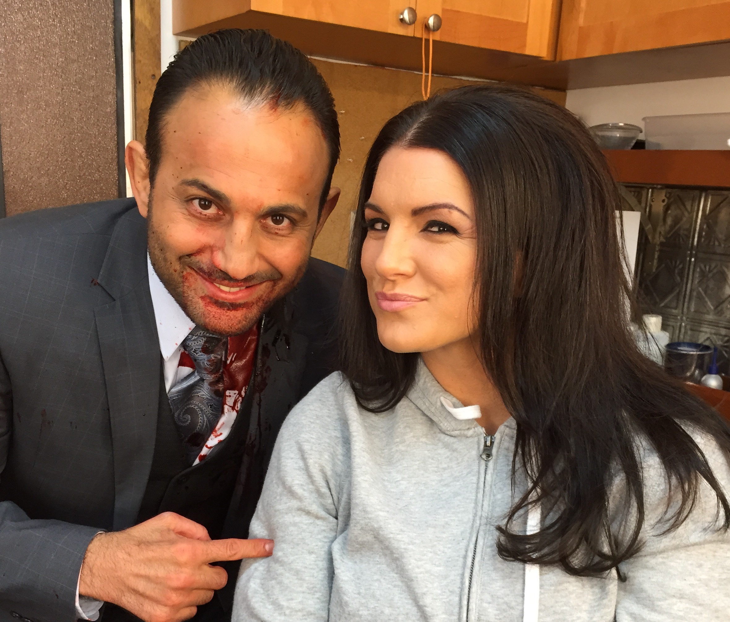 Roman Mitichyan with actress Gina Carano in film Extraction with Bruce Willis.