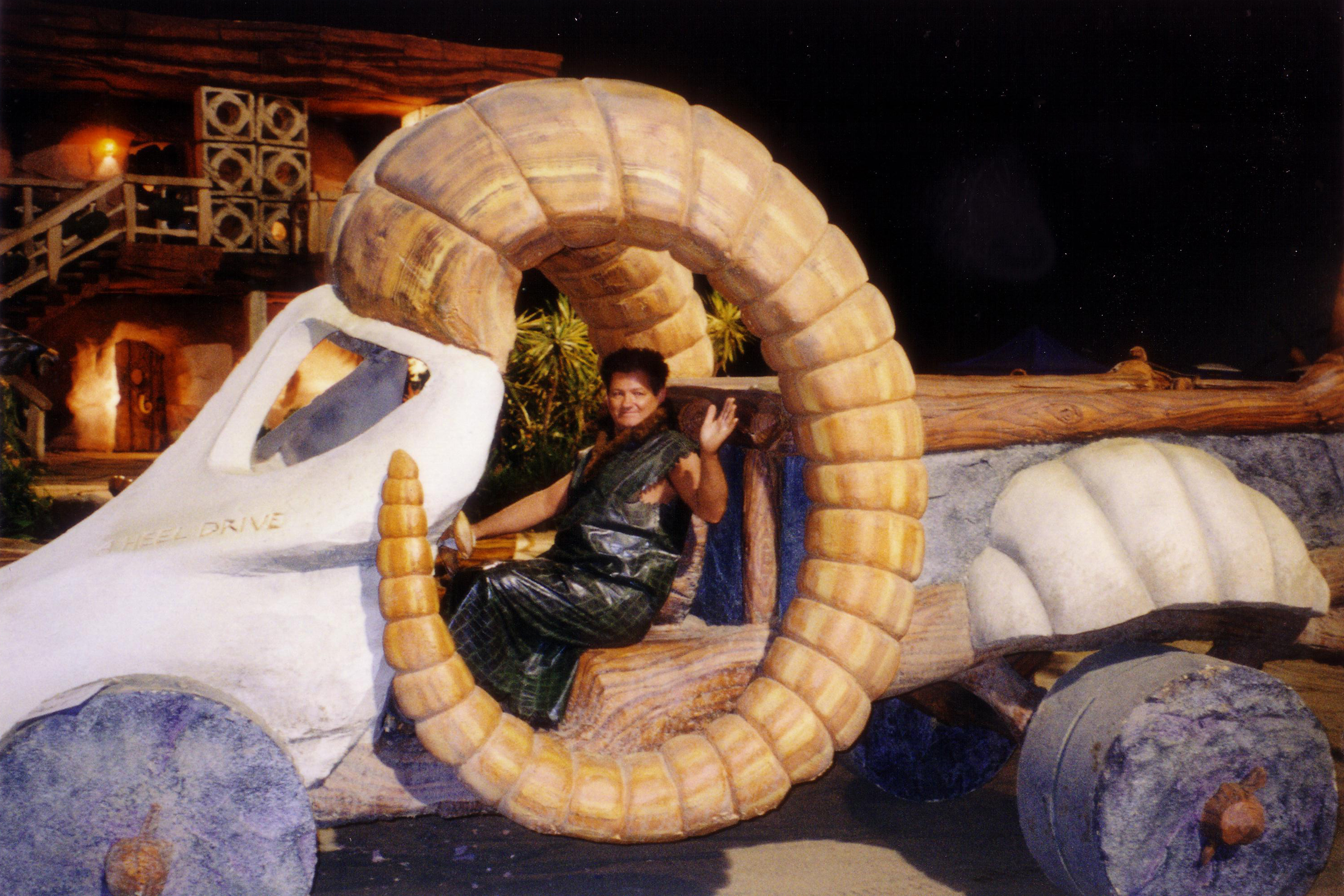 Seth driving the prehistoric 4-wheel drive Dodge Ram pick-up truck as his Bronto King Patron character one starry night at the gravel quarry set location of feature film The Flintstones in Viva Rock Vegas (2000)