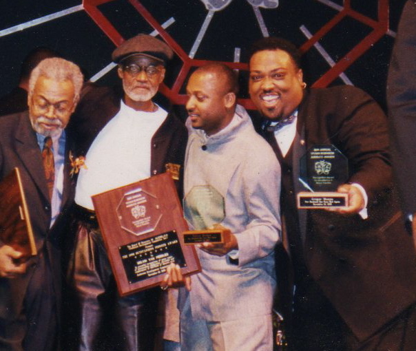 The 1998 AUDELCO Awards. Gregor Manns wins Best Lead Actor. On-stage, Amira Baraka, Melvin Van Peebles, and Fulton C. Hodges. Harlem, NY