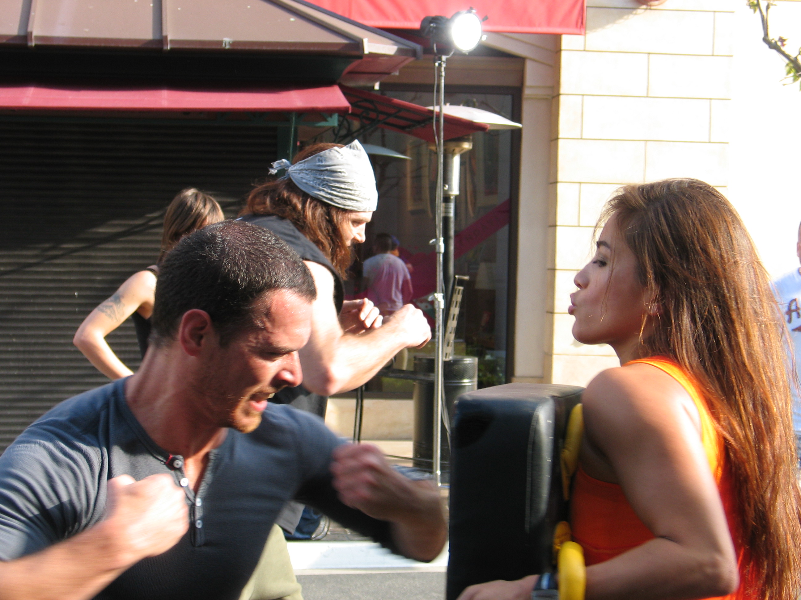 March 16, 2011. Cara Castronuova leads a televised work out for Mario Lopez at The Grove in Los Angeles.