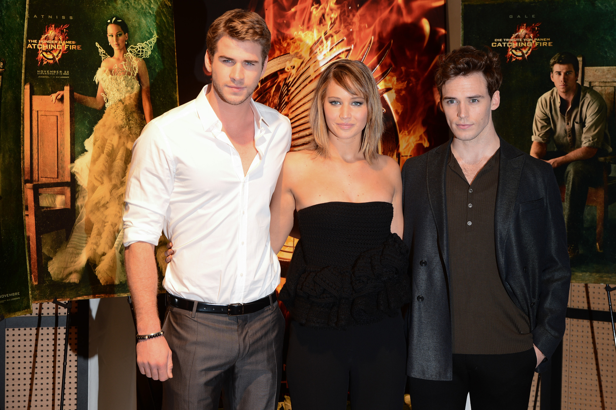 Jennifer Lawrence, Liam Hemsworth and Sam Claflin at event of Bado zaidynes. Ugnies medziokle (2013)