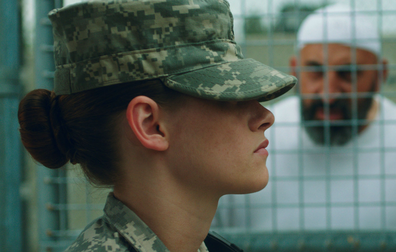 Still of Marco Khan and Kristen Stewart in Camp X-Ray (2014)