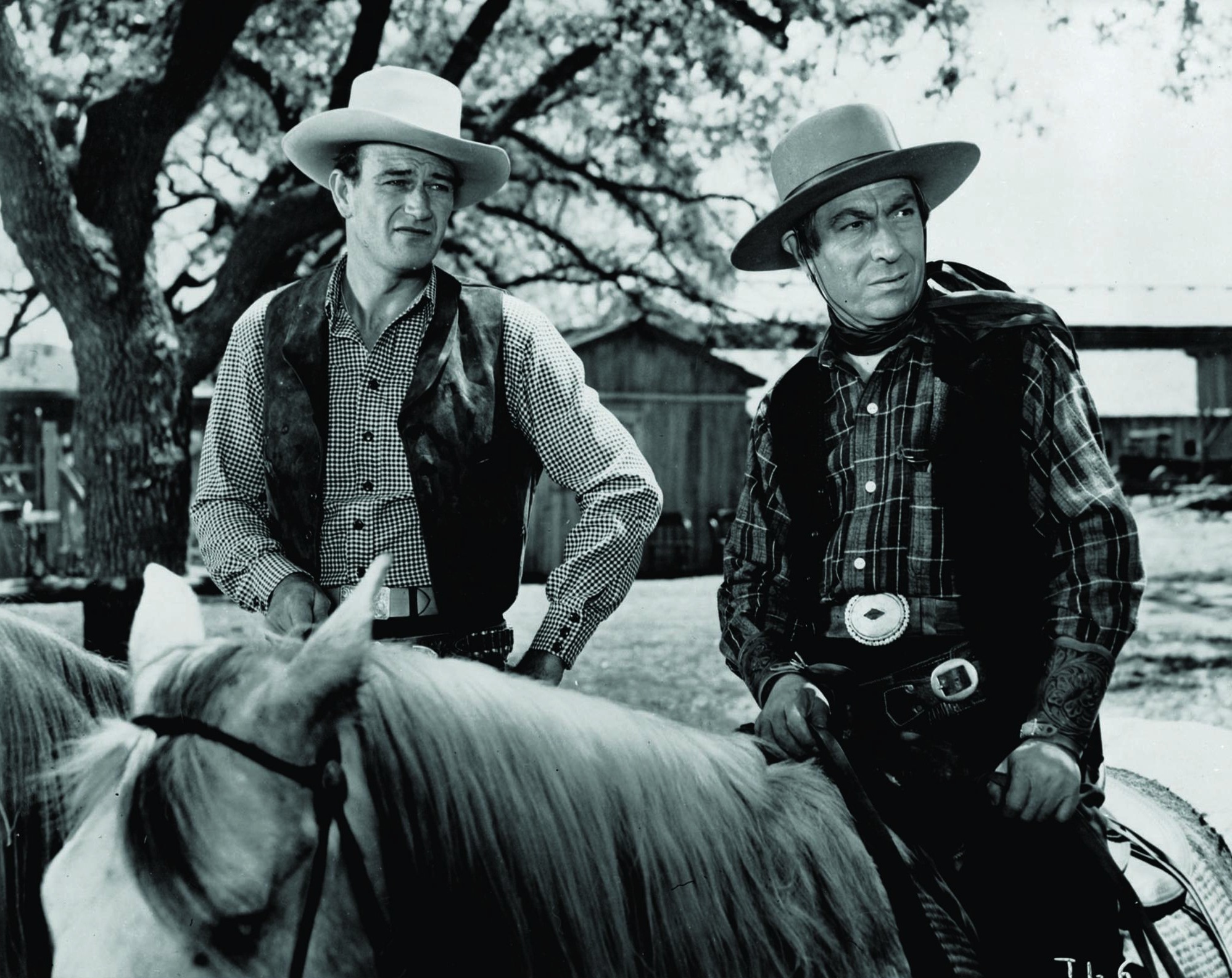 Still of John Wayne and Frank Puglia in Tall in the Saddle (1944)