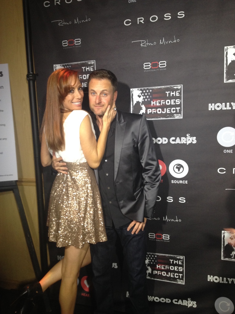 MOJO and the Bachelor's Host, Chris Harrison, attend The Heroes Project Celebrity Poker Tournament in Beverly Hills.