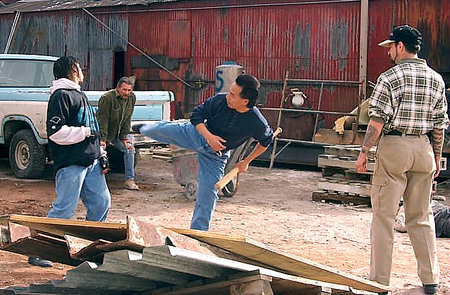 Mark Steven Grove (right) directs Ruselis Perry (left) and Julian Lee (center) in the taxi fight in Dragon and the Hawk.