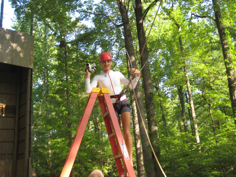 Destination host, Mieke Buchan, on location. Mieke, about to be hoisted up into the canopy of the trees, for a 