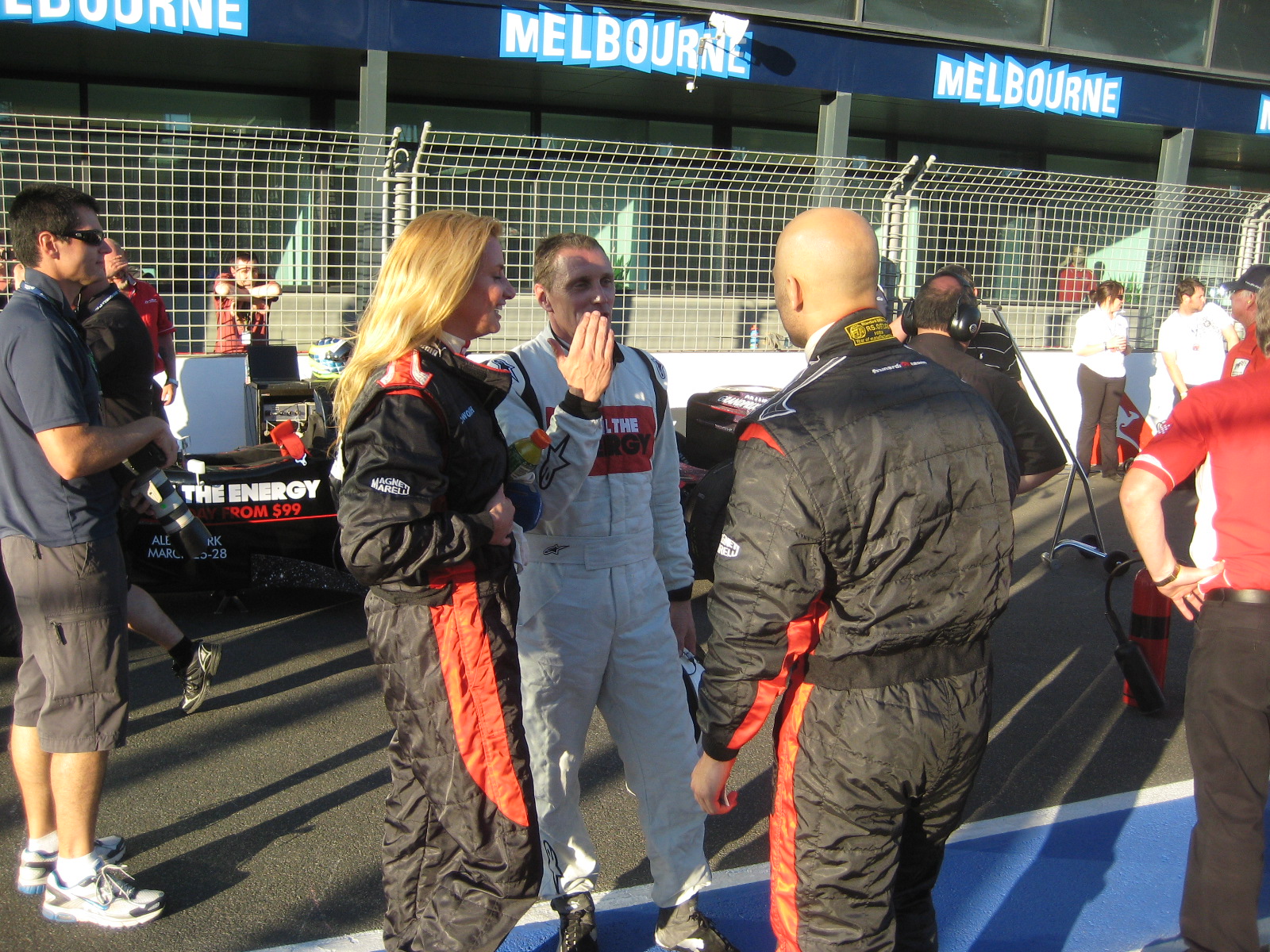 Mieke Buchan, AFL star Gary Ablett Jr, and driver Cam McConvil, debrief after their F1 Hot Laps. Australian F1 Grand Prix. 2010