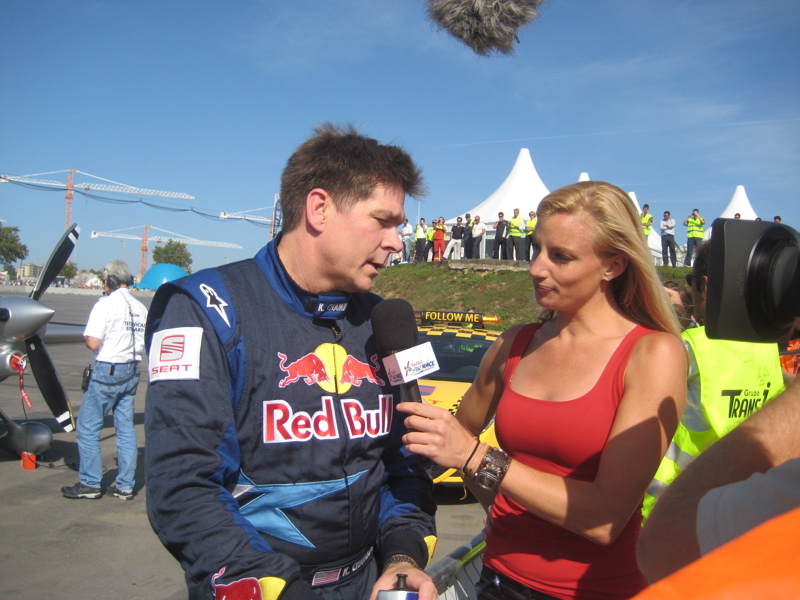 Field reporter, Mieke Buchan, interviews pilot Kirby Chambliss, at the conclusion of finals racing. Red Bull Air Race World Series. 2008. Porto, Portugal