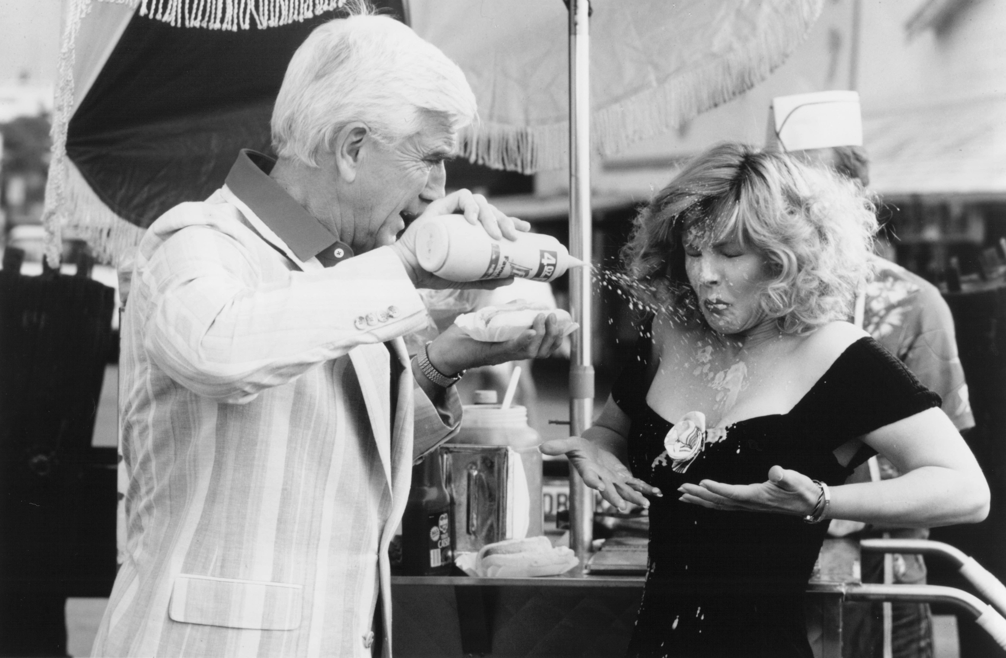 Still of Leslie Nielsen and Priscilla Presley in The Naked Gun: From the Files of Police Squad! (1988)