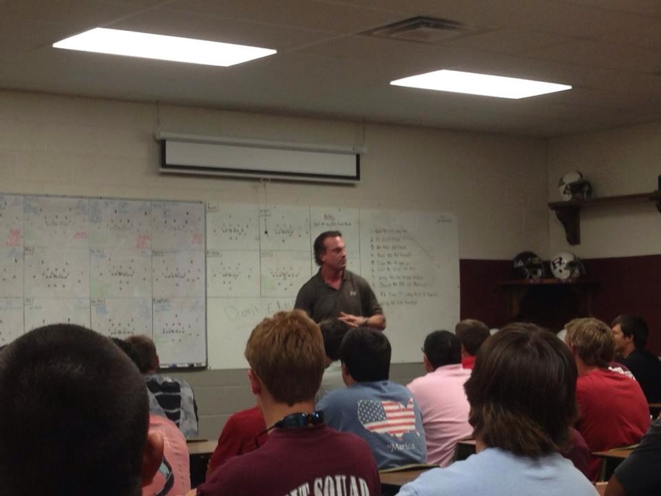Scott Jefferies speaking to the a Midland Robert E. Lee High a School football team.