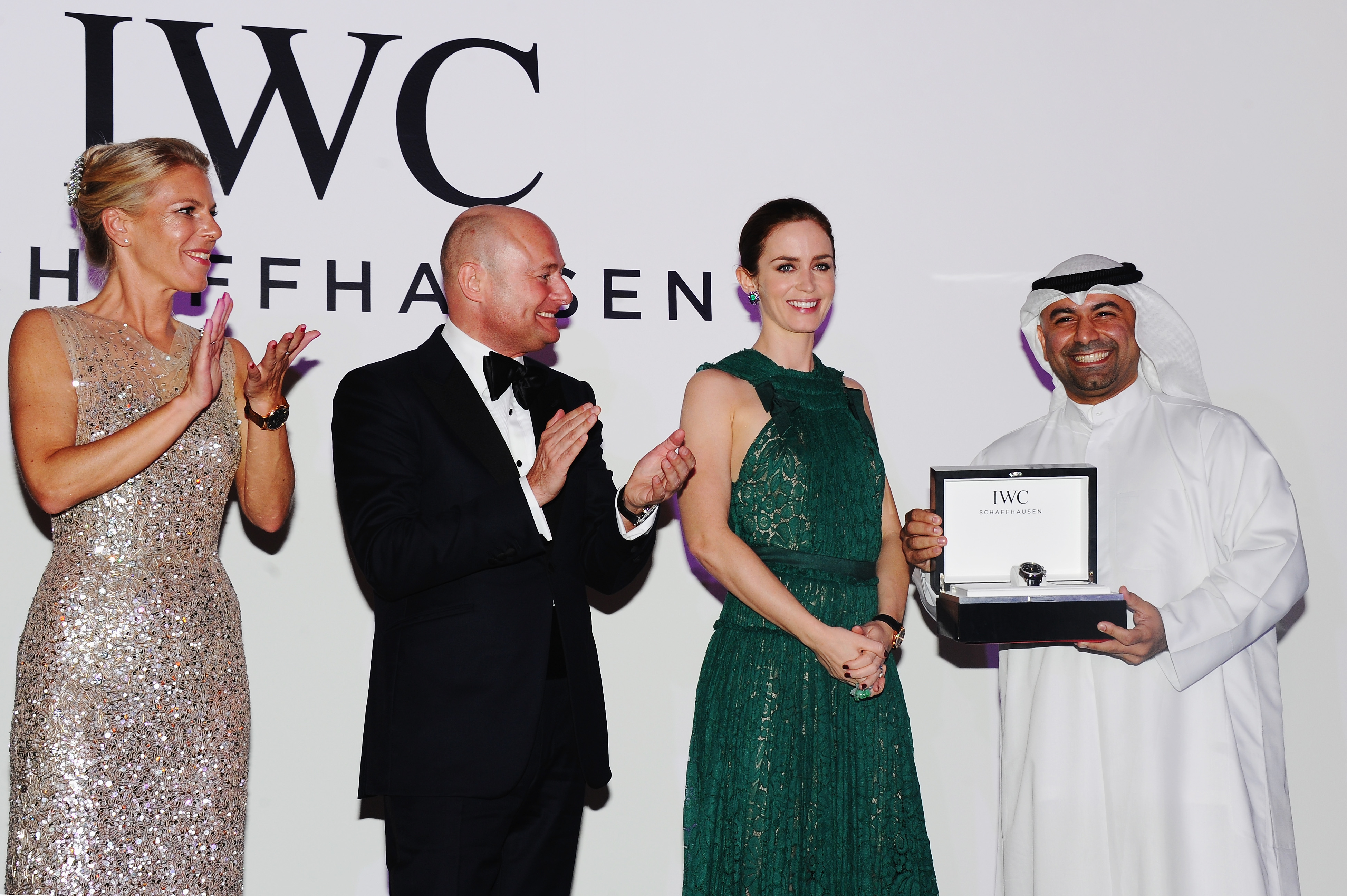 Abdullah Boushahri receiving the IWC Filmmaker Award from Emily Blunt at DIFF