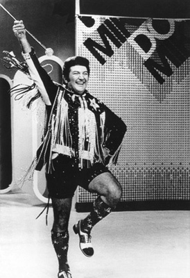 Lee Liberace on a television show in Philadelphia wearing hot pants as he performs for a studio audience