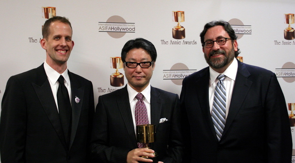 Feature production design winner Tadahiro Uesugi surrounded by presenters Pete Docter and Bob Peterson
