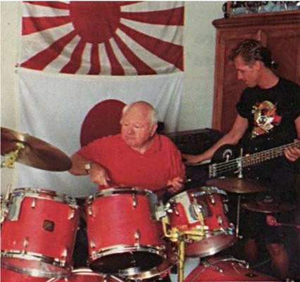Mickey Rooney on drums with son Mark Rooney on guitar in 1990.