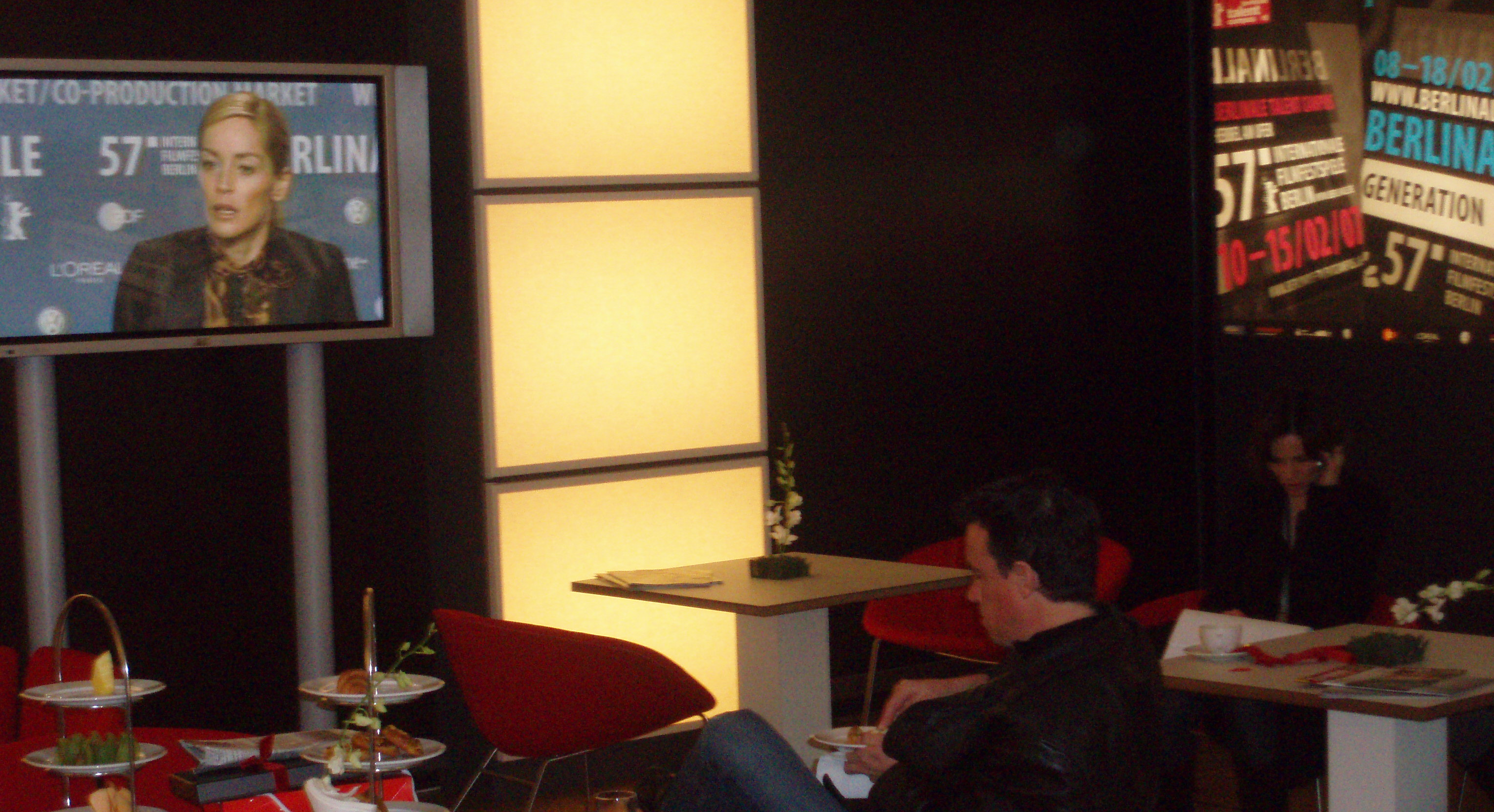 Reid in the VIP Green room at the Berlin Film Festival as Sharon Stone conducts TV interviews