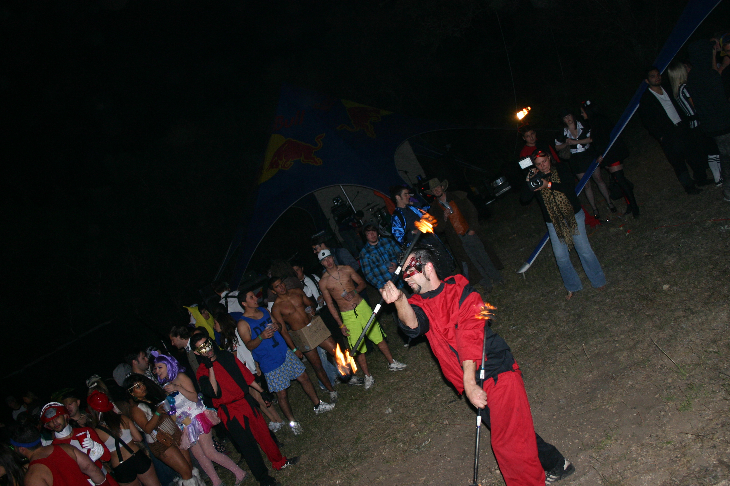 Producer Robin Blesch filming fire-dancers at Halloween on Haunted Hill in San Antonio before WPFG Studios artist YaBoi Lavish performed for almost 1000 party guests.