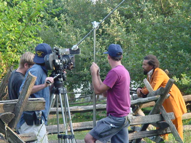 Behind the scenes photo of Algernon Ward being filmed on the set of 