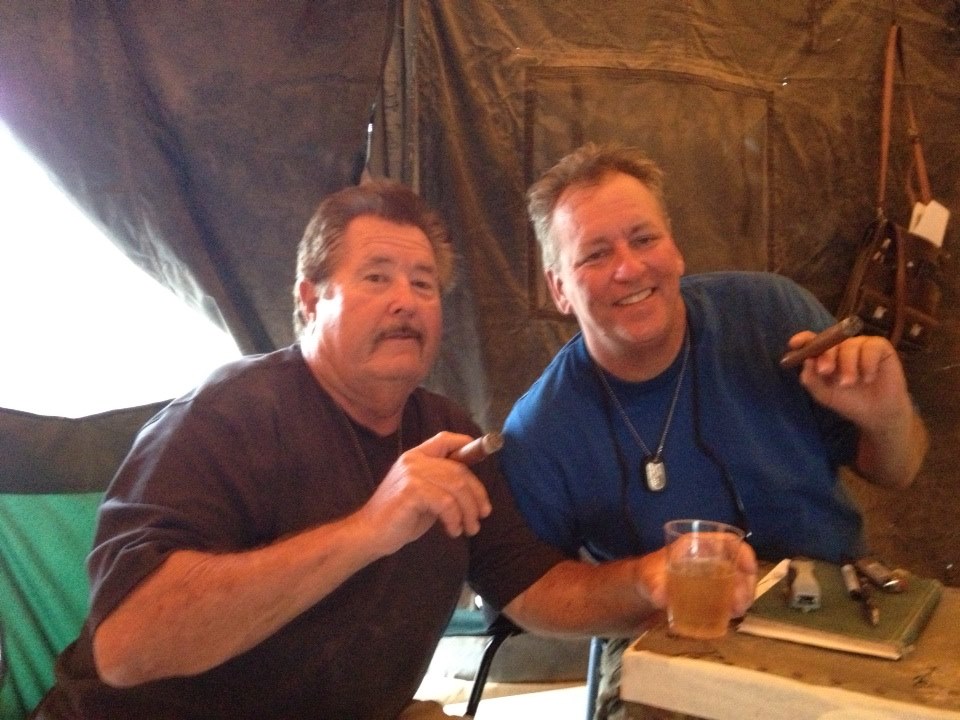 Executive Producer Rene Veluzat and Producer Lance Miccio on set in Officers tent .