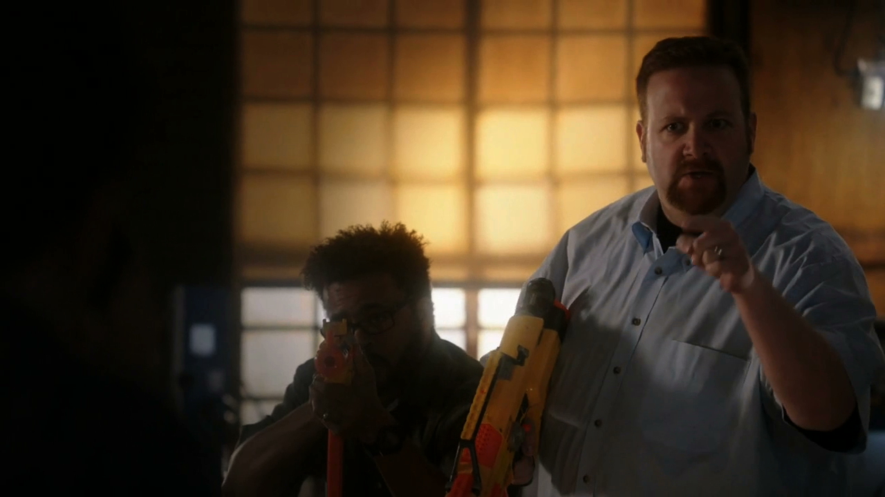 Al the IT Guy (Ben Zelevansky) and a co-worker (Jamison Reeves) open fire with Nerf guns on 