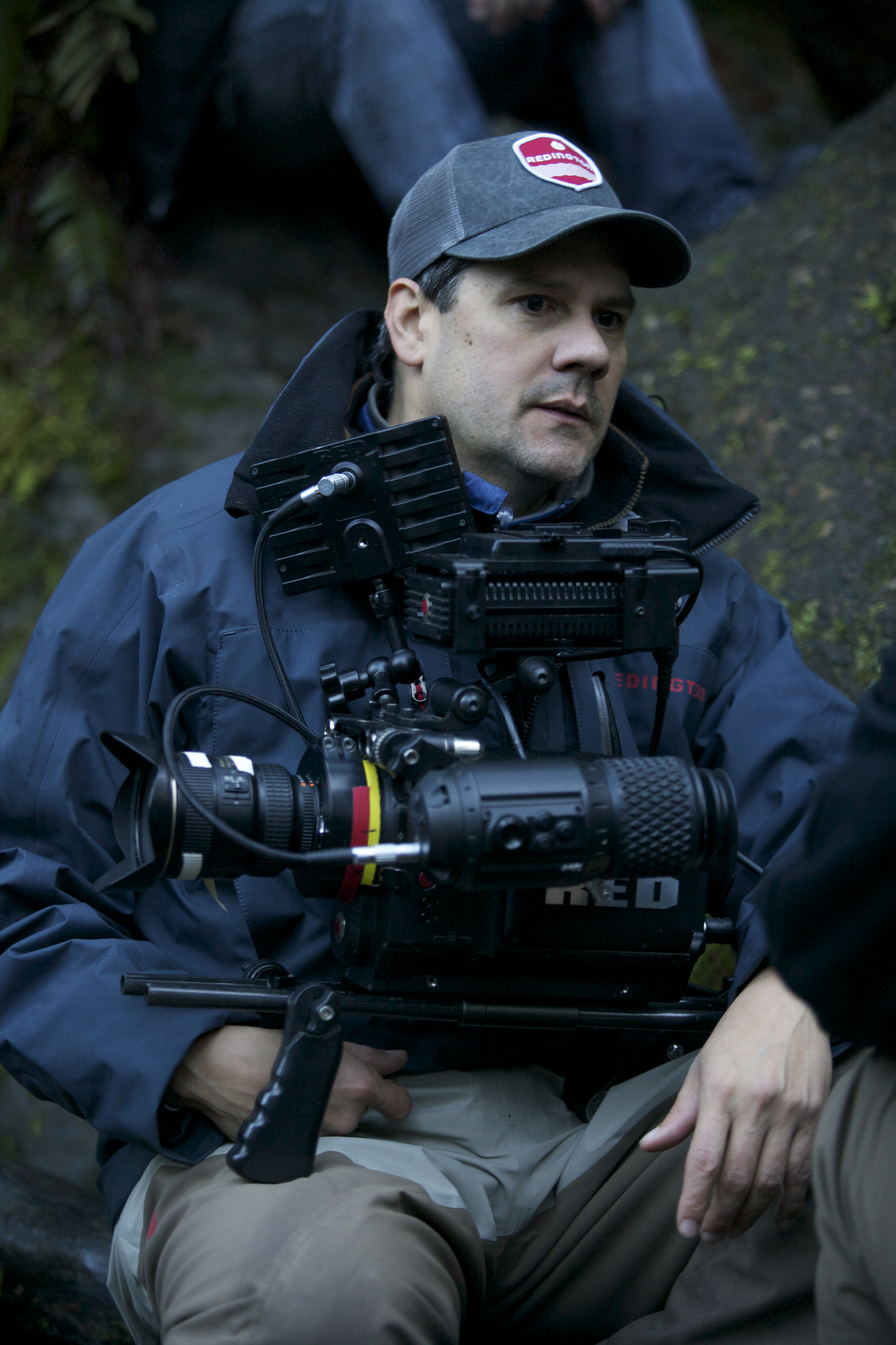 Director Scott A. Capestany contemplating his next shot high above a 100 foot waterfall (notice the boulders behind him)on location at Lake Quinault, WA while filming his TV Series THE RAINFOREST.