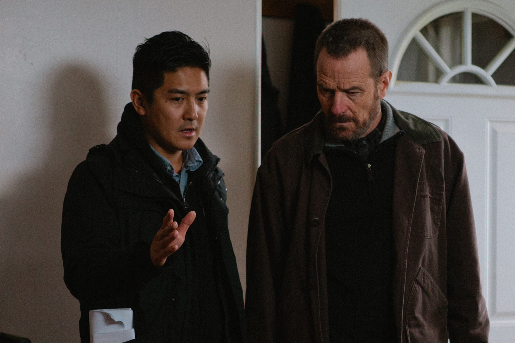 Tze Chun and Bryan Cranston on the set of Cold Comes the Night (2014)