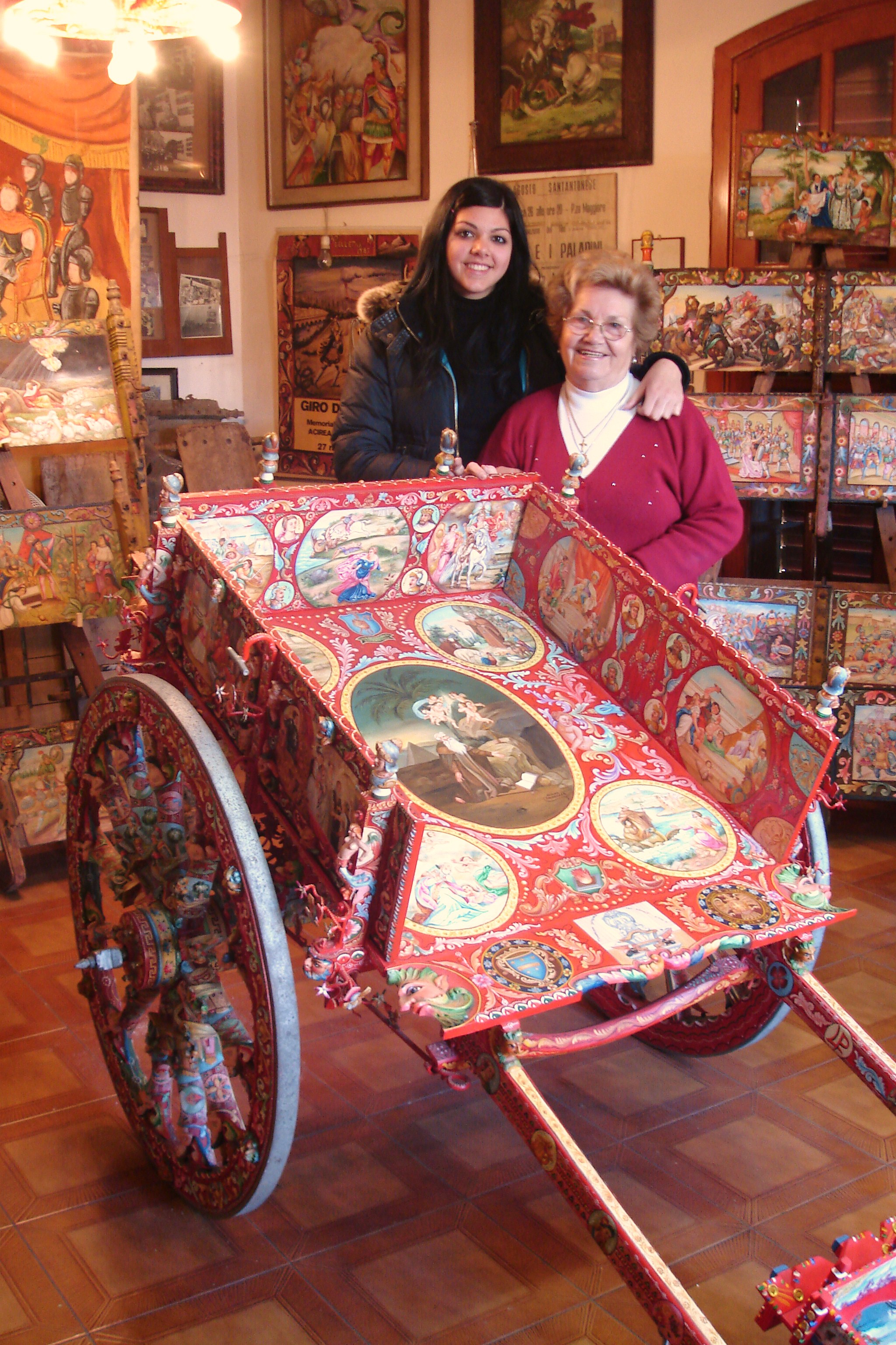 World-famous Sicilian cart artist, Nerina Chiarenza, featured in A SICILIAN ODYSSEY, with her granddaughter in Aci S. Antonio (Province of Catania)