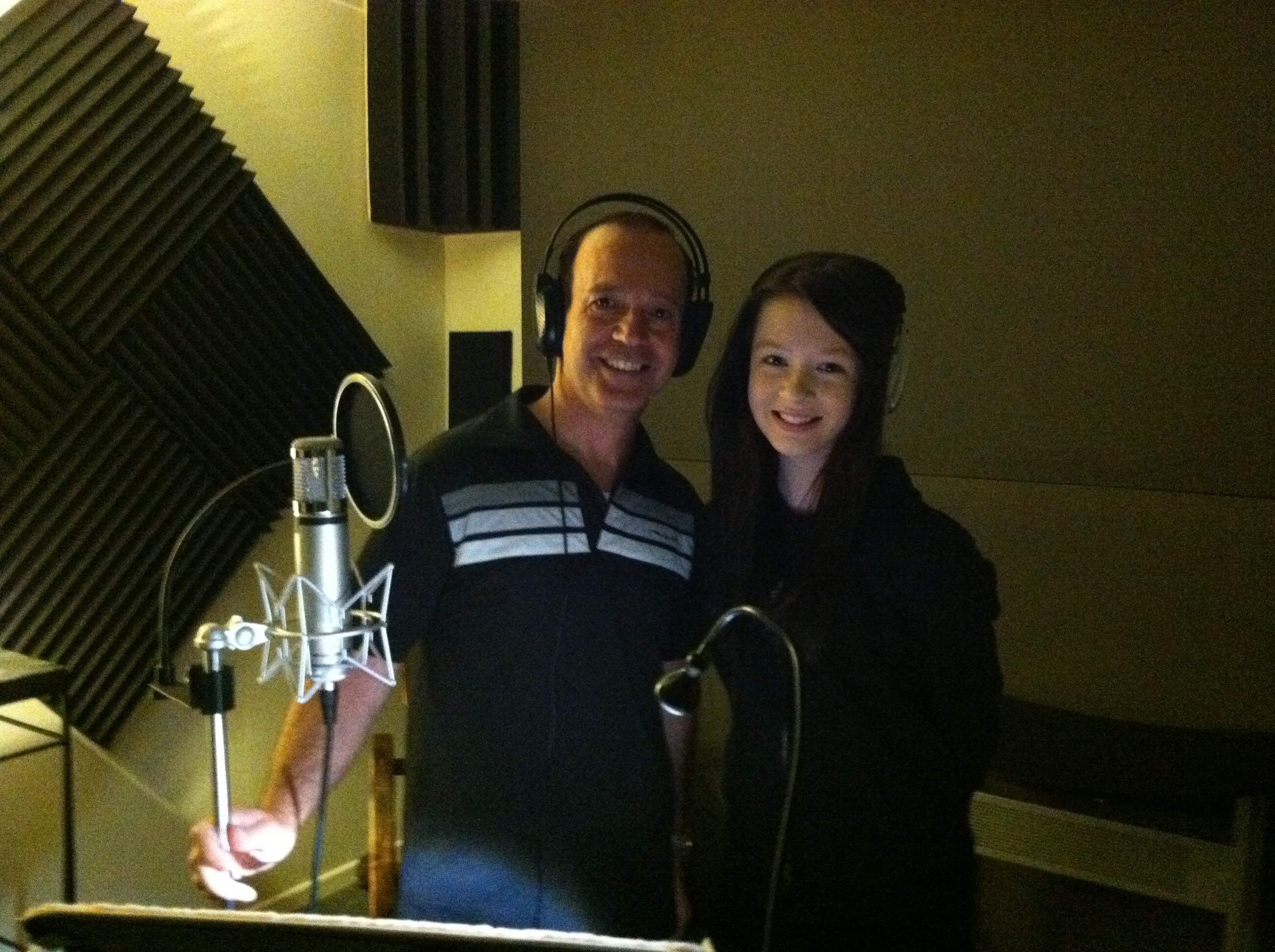 Mary-Jessica Pitts, in the booth with Kamal Aboukhater, the director of Fergus & Crispy. Mary-Jessica voices Teen Emily.