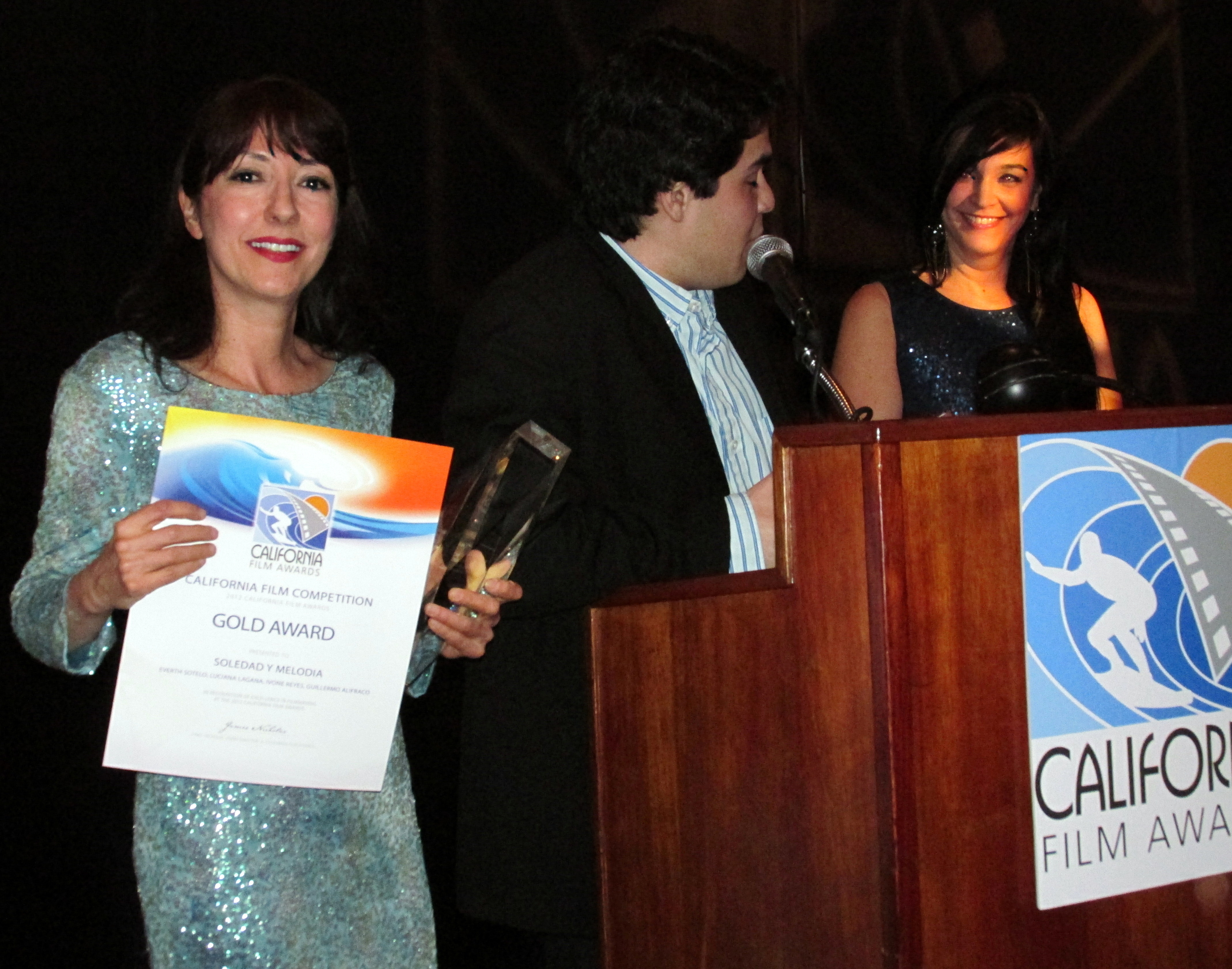 Luciana Lagana, Everth Sotelo, And Ivone Reyes receiving the Gold Award for Best Short Film 