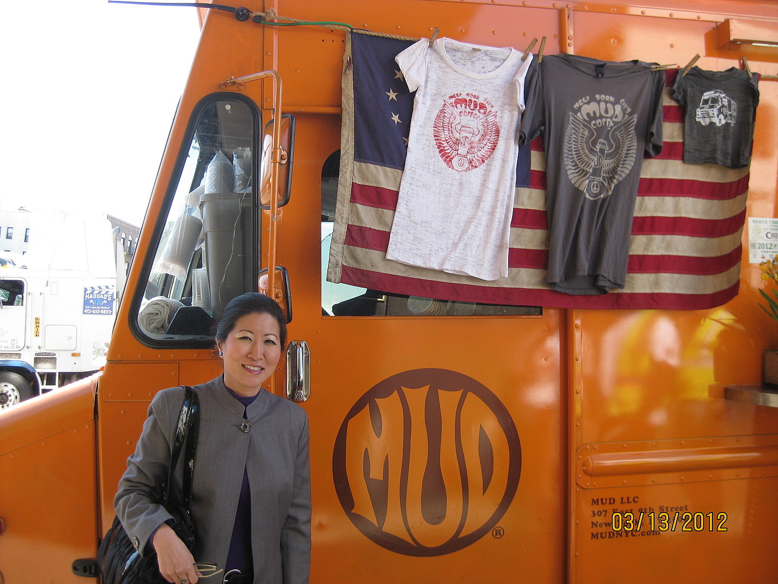 Lil Rhee in front of the Mud coffee truck