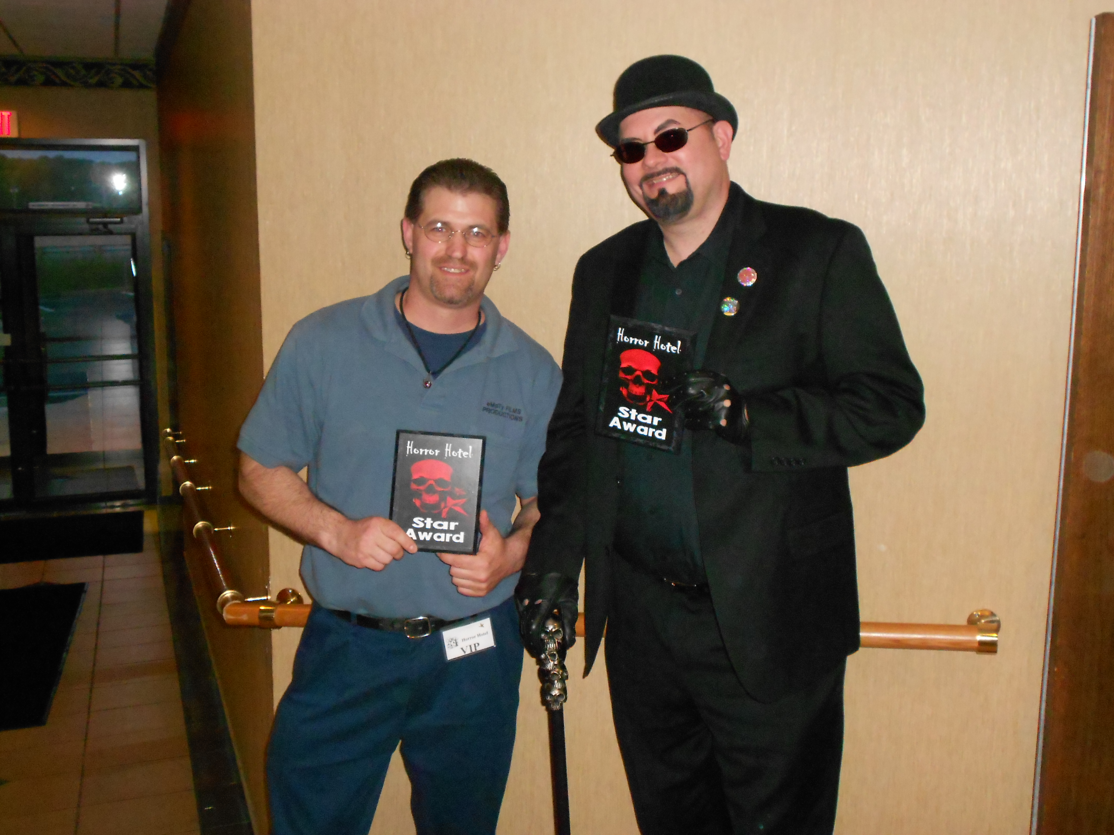 Accepting an Award along with Baron Bloodstorm at the 2012 Horror Hotel Film Convention.