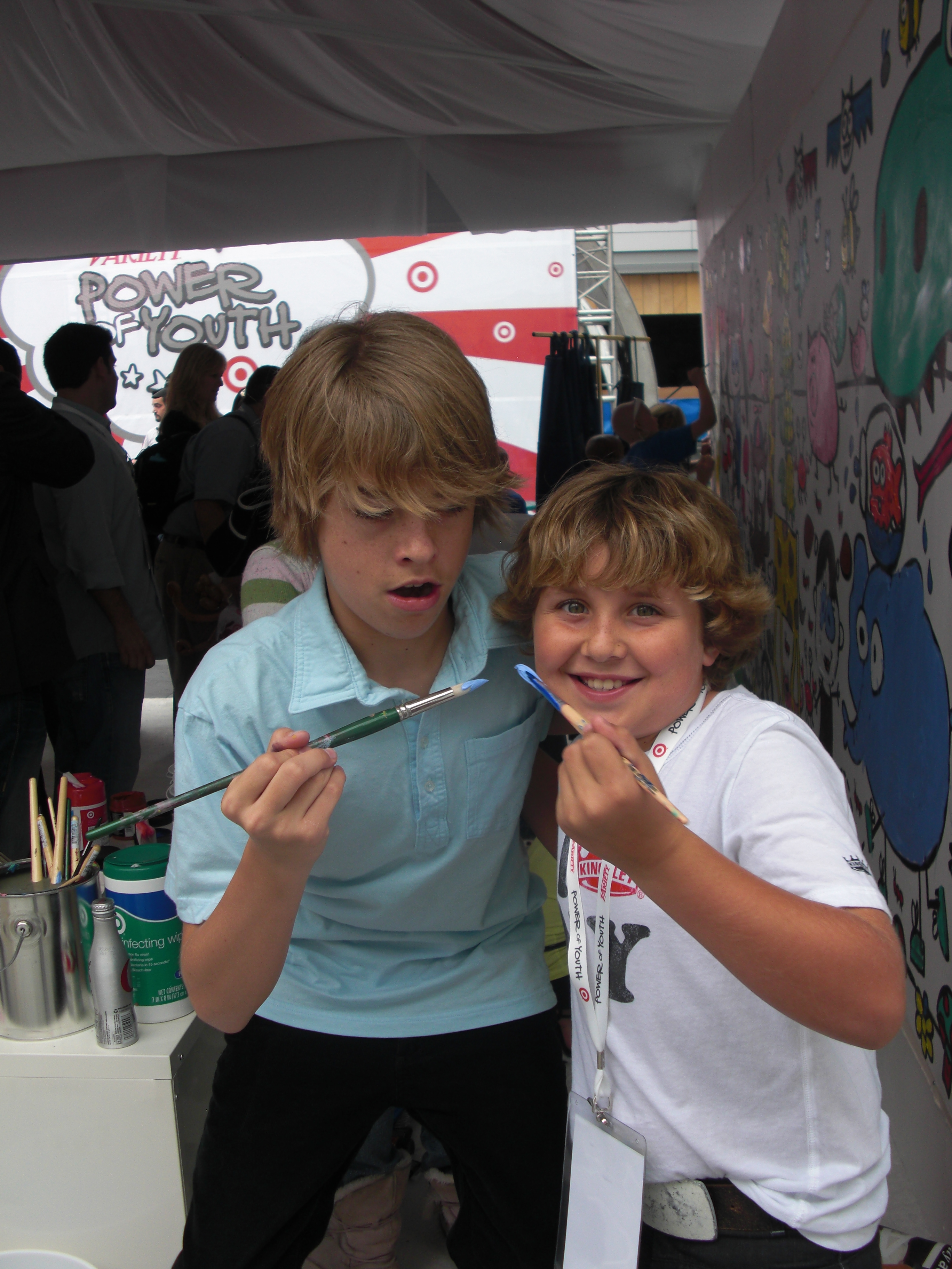 Cole Sprouse & Bryce Hurless painting the wall at the Power of Youth Event 2009