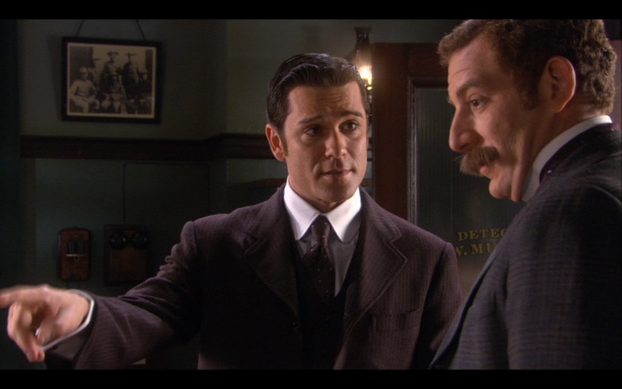 Yannick Bisson as William Murdoch, Peter Mikhail as HG Wells, Murdoch Mysteries.