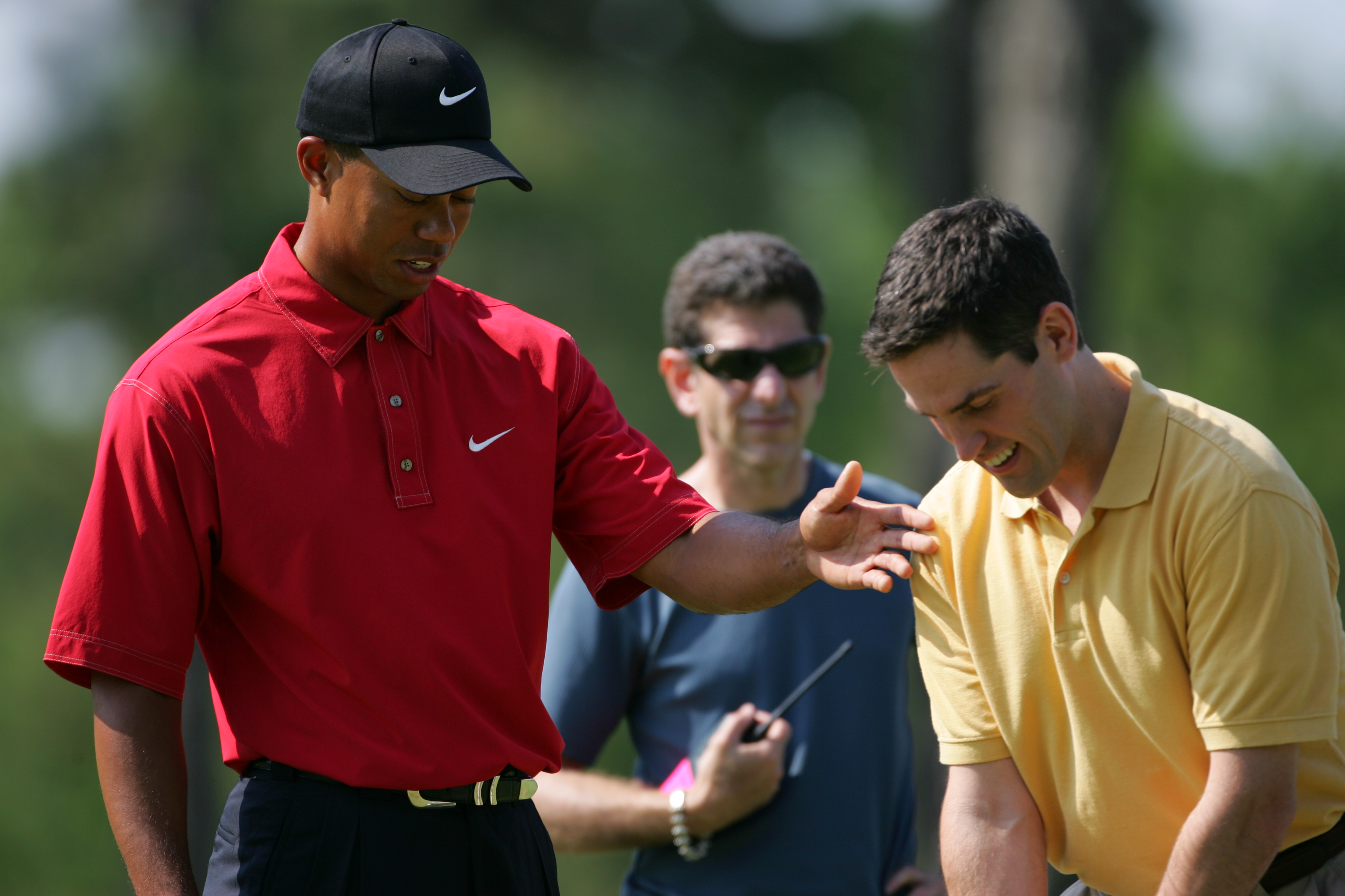 Dave gives Tiger Woods a golf lesson during the shoot for an EA Sports commercial.