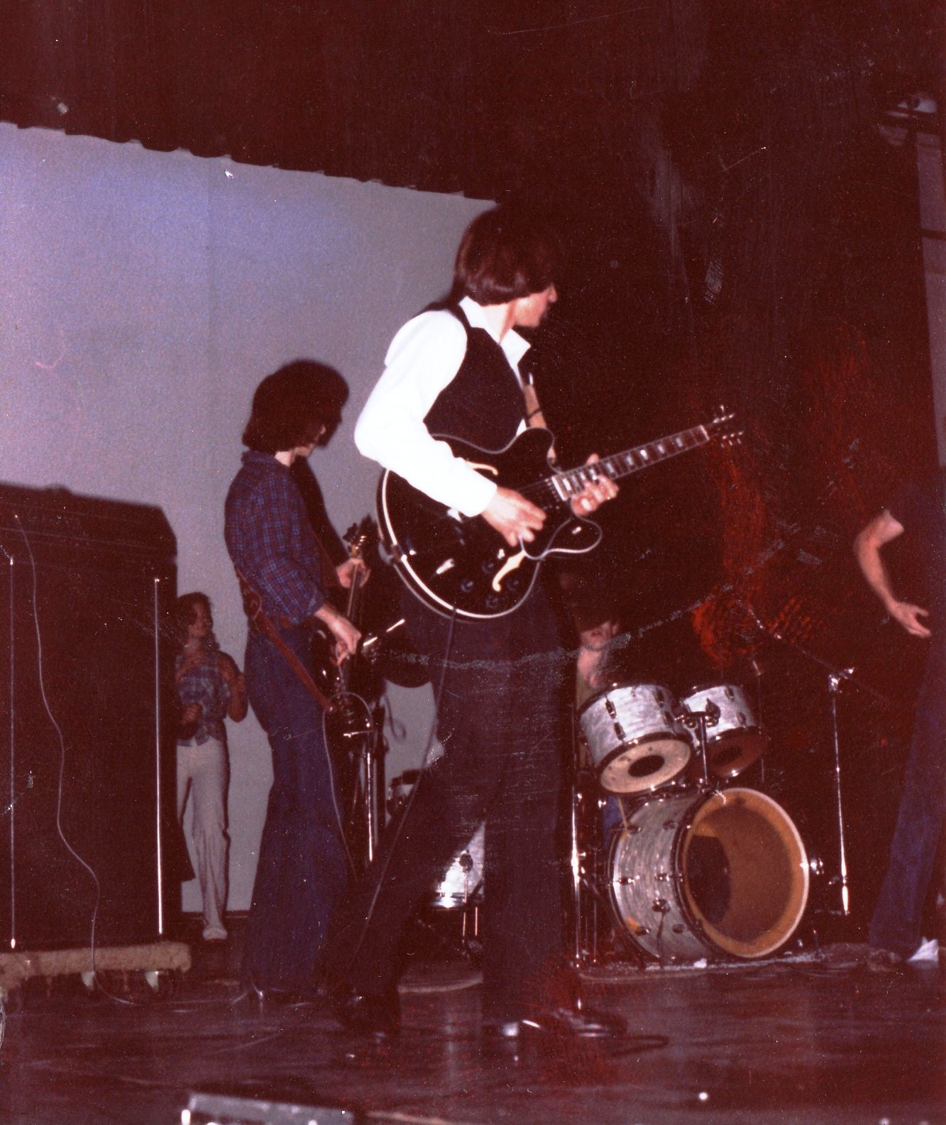 Alex as the lead guitarist for Rockin' Roll is turning up the volume and pelts out a screaming lead on the Gibson ES-335 for the sold out show and standing ovation encore performance (unrehearsed).