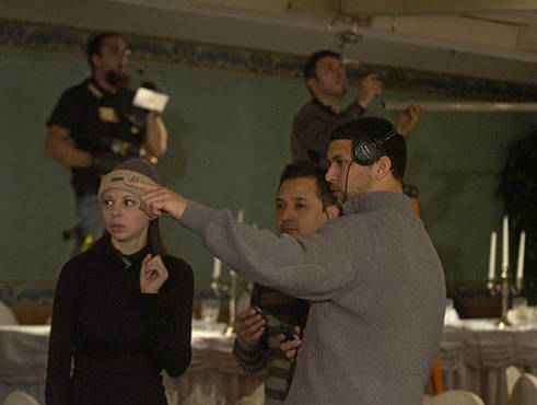 Director Pieter Gaspersz works with Costume Designers Rosalind Bullard and Ivan Alvarez on set.