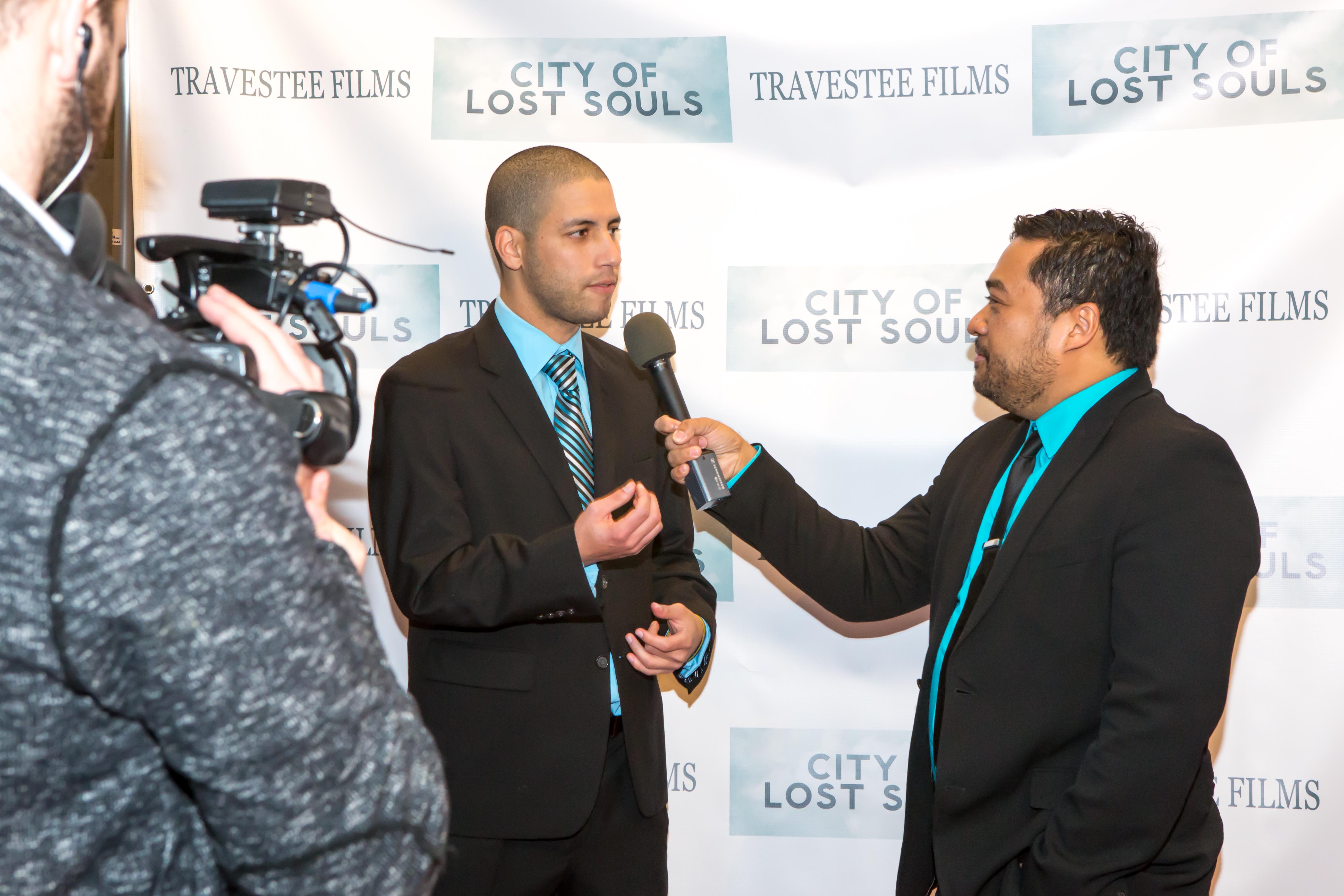 Director Jason Baustin getting interviewed at the premiere of 
