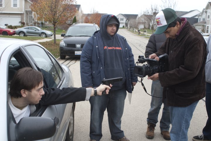 Cinematographer Josh Struska gets the shot of Jack Guasta (Poe) while Producer David Baker blocks the view from the neighborhood.