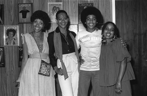 The Sylvers visiting the Los Angeles offices of Cashbox music trade magazine (Sheila Eldridge of Casablanca Records, Angie Sylvers, Foster Sylvers, Carita Spencer - R&B Editor at Cashbox Magazine)